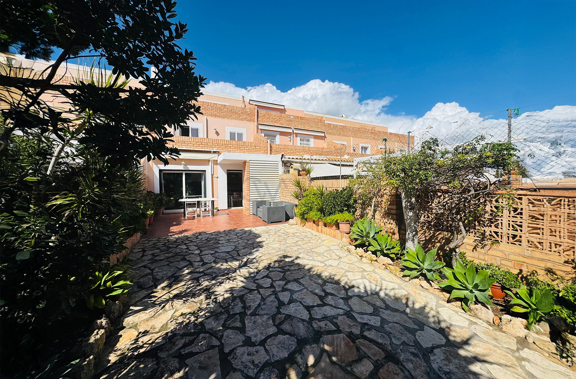 Elegant Triplex Townhouse with Private Garden in Es Vivé